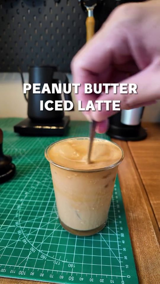 Editorial coffee and condensed milk drink on kitchen counter