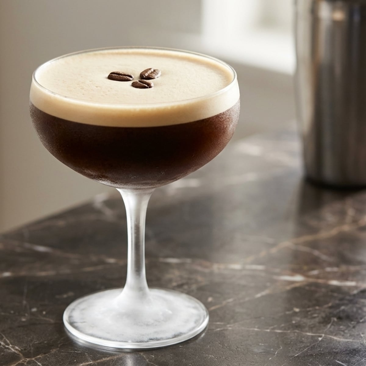 Chilled espresso martini in a frosted coupe glass with rich foam
