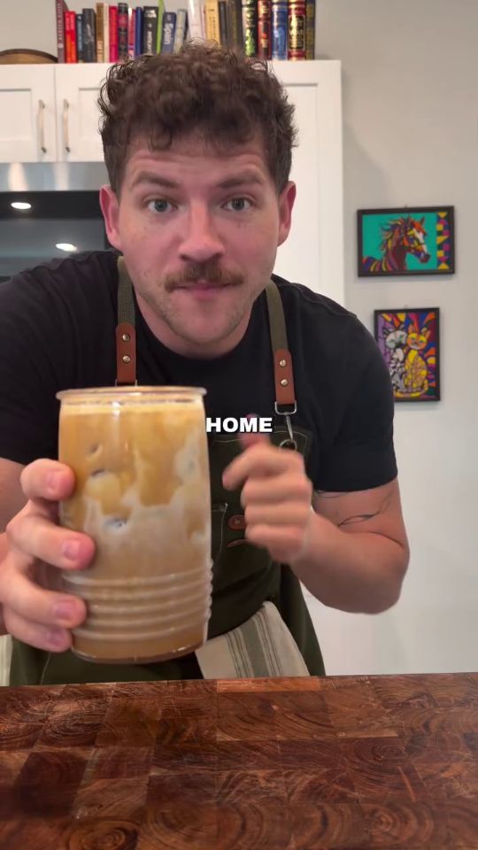 Editorial coffee and condensed milk drink on kitchen counter