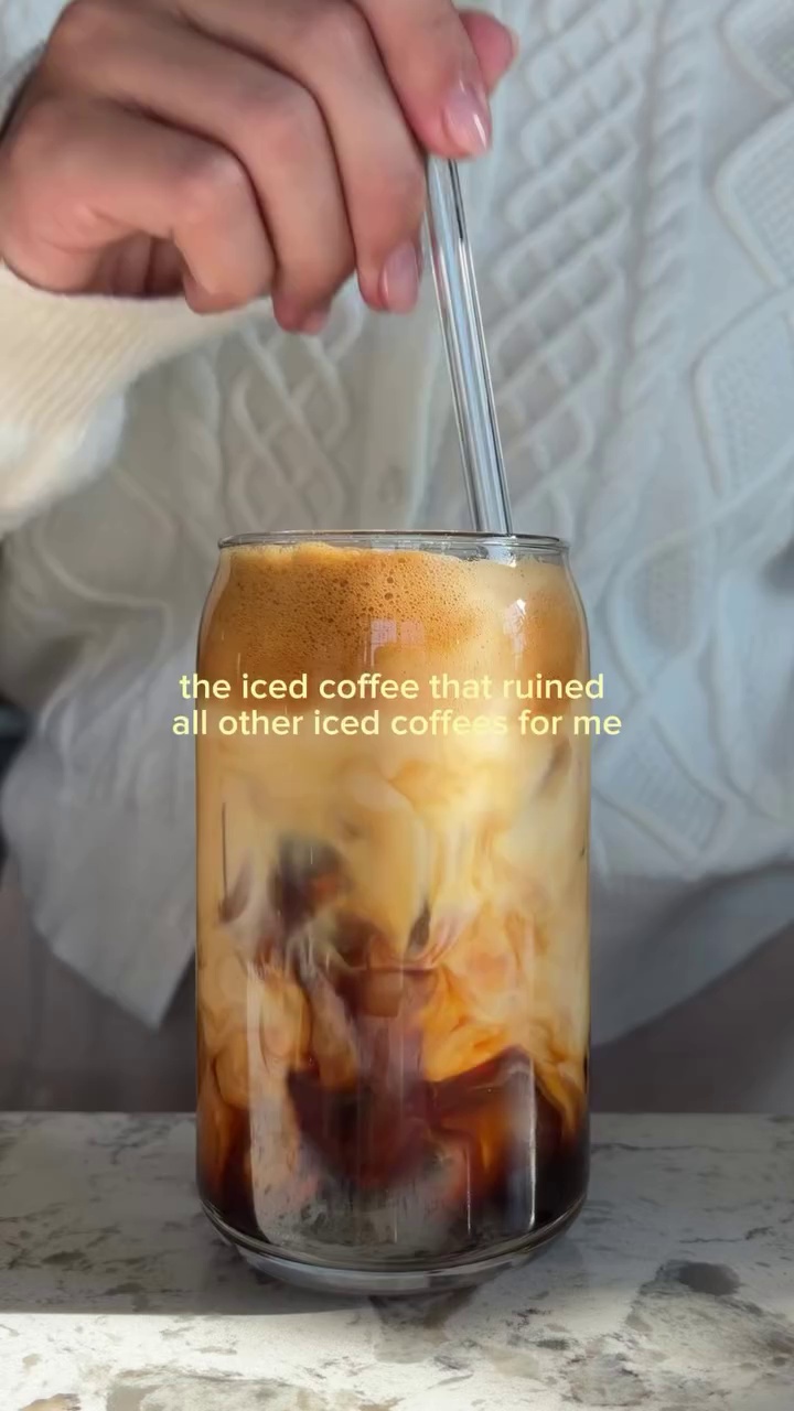 Editorial coffee and condensed milk drink on kitchen counter
